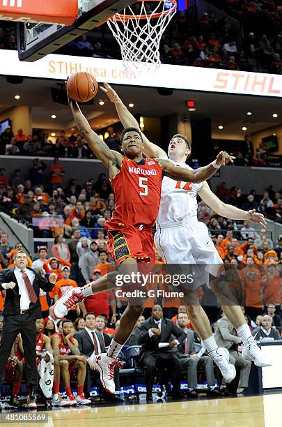 Nick Faust of the Maryland Terrapins dunks the ball against the Virginia Cavaliers at John Paul Jones Arena on February 10, 2014 in Charlottesville,...