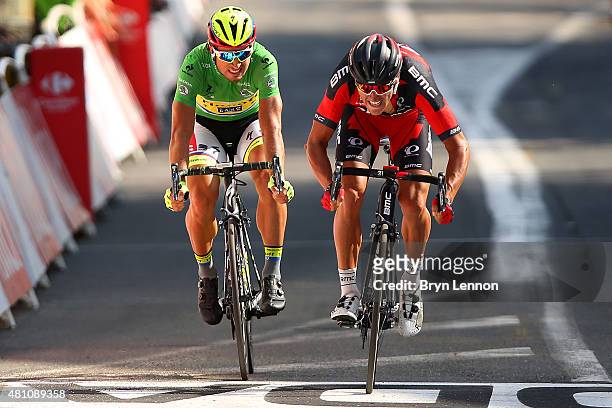 Greg van Avermaet of Belgium and BMC Racing Team crosses the finish line ahead of Peter Sagan of Slovakia and Tinkoff-Saxo during stage thirteen of...