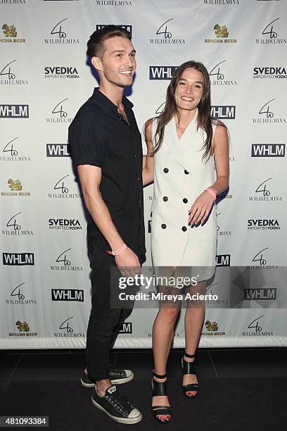 Models Brandon Grey and Jessica Sikosek attend the Wilhelmina Models Men's NYFW party in celebration of the 'Wolf Pack' at Marquee on July 16, 2015...