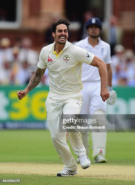 Mitchell Johnson of Australia celebrates after taking the wicket of Joe Root of England during day two of the 2nd Investec Ashes Test match between...