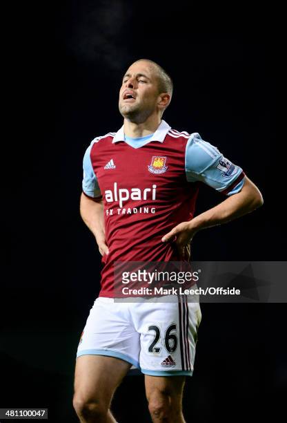 Joe Cole of West Ham United reacts during the Barclays Premier League match between West Ham United and Hull City at Upton Park on March 26, 2014 in...