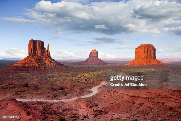 the mittens and merrick butte at sunset - monument valley stock pictures, royalty-free photos & images