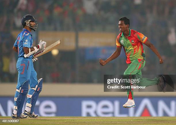 Al-Amin Hossain of Bangladesh celebrates after dismissing Shikhar Dhawan of India during the ICC World Twenty20 Bangladesh 2014 match between...