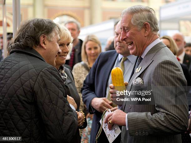 Camilla, Duchess of Cornwall and Prince Charles, Prince of Wales share a joke as Raymond Blanc looks on as the Duchess holds a squash during The...