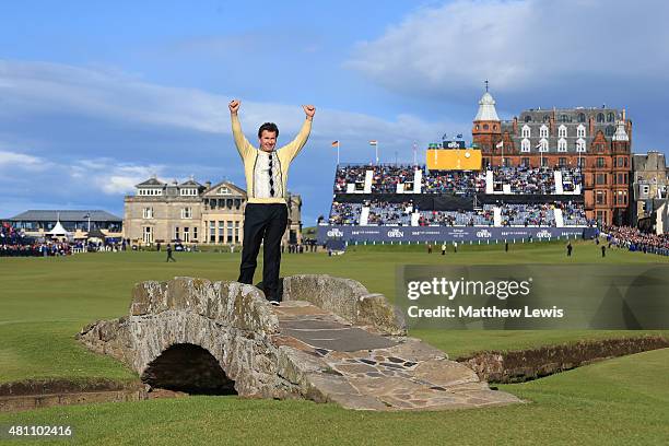 Sir Nick Faldo of England waves to the crowd as he stands on Swilcan Bridge during the second round of the 144th Open Championship at The Old Course...