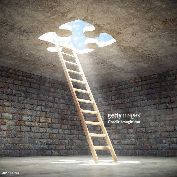 ladder leading up to the light - escaping stockfoto's en -beelden