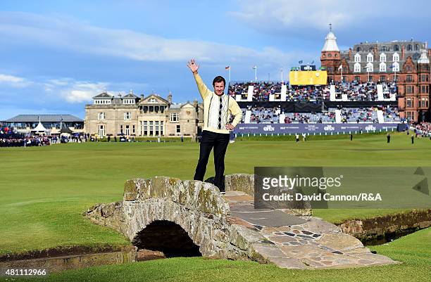Sir Nick Faldo of England waves to the crowd as he stands on Swilcan Bridge during the second round of the 144th Open Championship at The Old Course...