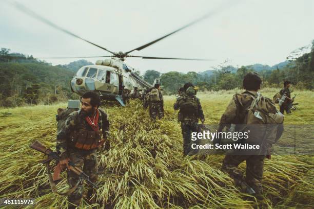 Troops of the Sandinista Popular Army , taking part in a heliborne operation against the Contra rebels, in Nicaragua near the border with Honduras,...