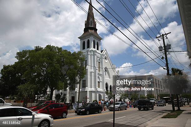 Traffic passes by the Emanuel AME Church on the one-month anniversary of the mass shooting on July 17, 2015 in Charleston, South Carolina. Visitors...