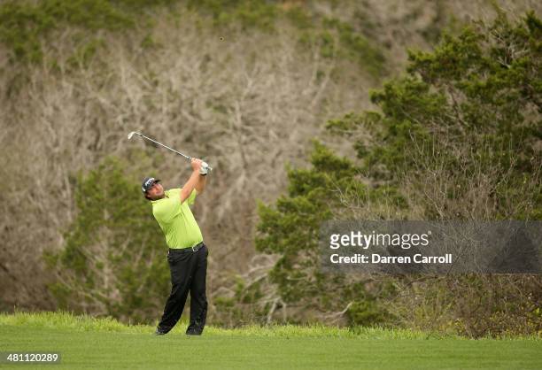 Steven Bowditch takes his second shot on the 17th during Round Two of the Valero Texas Open at TPC San Antonio AT&T Oak Course on March 28, 2014 in...
