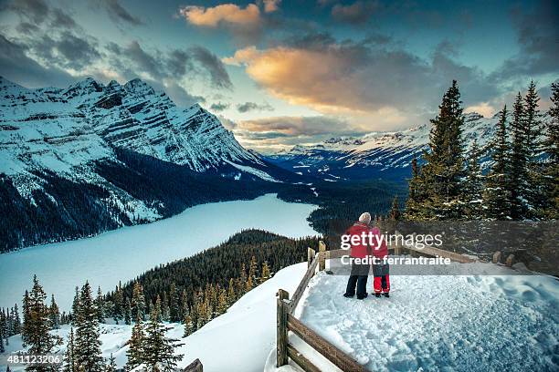 mother and daughter enjoying banff national park in winter - banff national park camping stock pictures, royalty-free photos & images