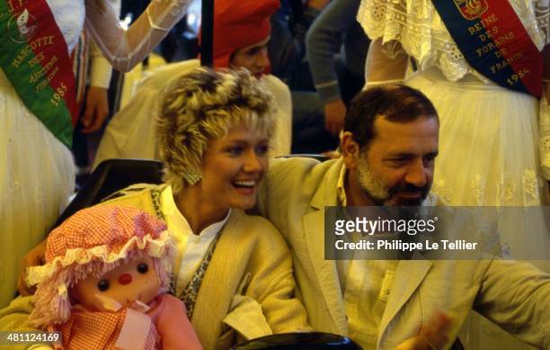 The actor and director Jean Yanne with his wife Mimi Coutelier to the Foire du Trone, Paris, France 1988.
