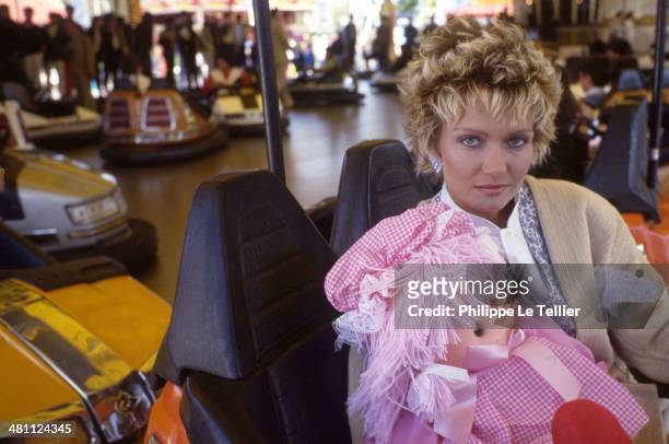The actress Mimi Cutler in a carousel at the Foire du Trone in Paris in 1988.