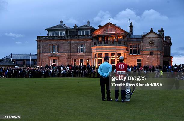 Tom Watson of the United States waits on the 18th green alongside his caddie and son Michael Watson during the second round of the 144th Open...