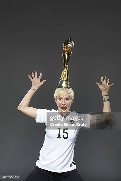 World Cup Champions: Portrait of US Women's National Team midfielder Megan Rapinoe holding trophy during photo shoot at New York City Hall. New York,...
