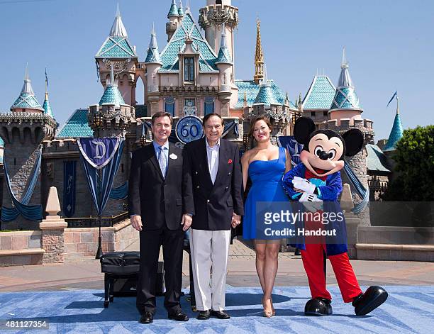 In this handout photo provided by Disney parks, DAZZLING DAY - Academy Award-winning composer Richard Sherman and actress and singer Ashley Brown...
