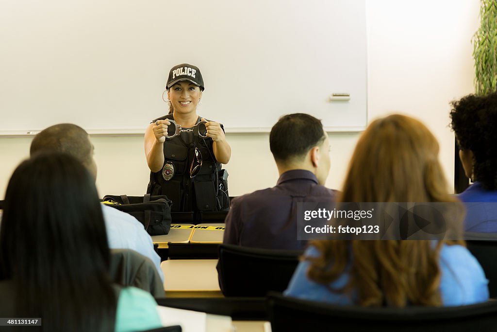 Law:  Policewoman speaks to police cadets or community.