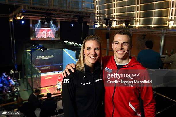 Women's World Champion Laura Massaro of England and Men's World Champion Nick Matthew of England pose for photos during the Canary Wharf Squash...