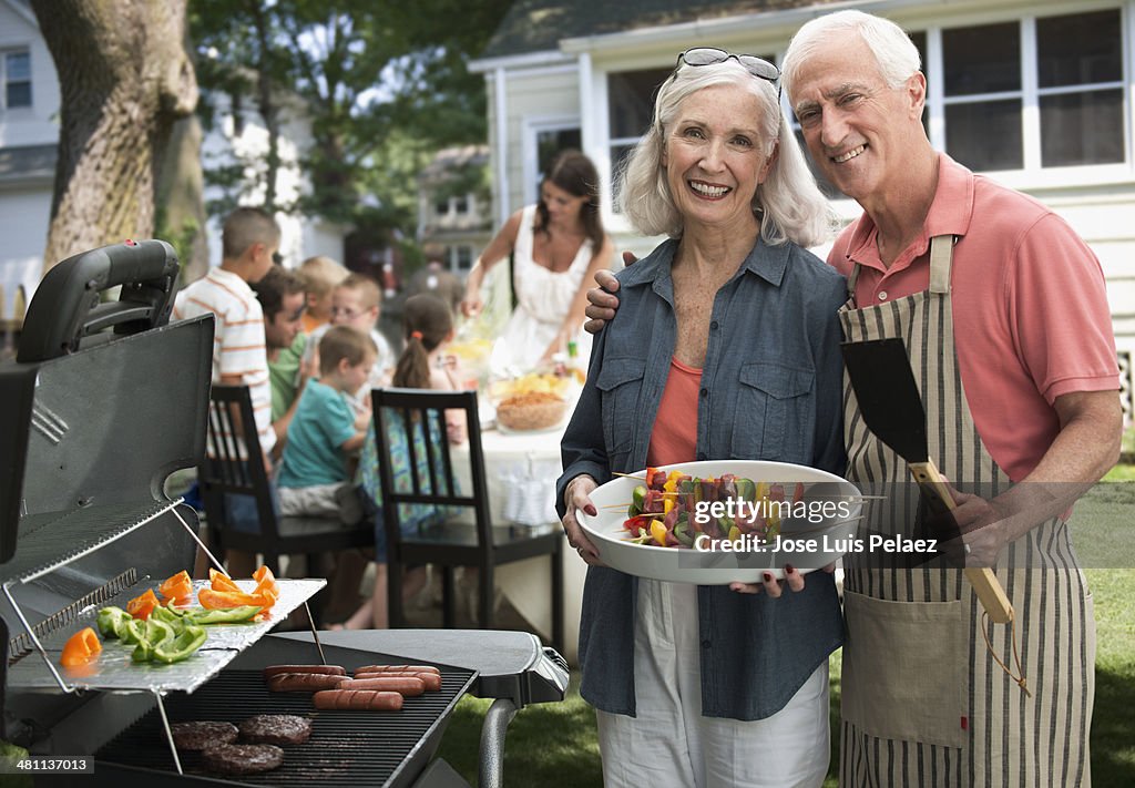 Portrait of elderly couple at the grill