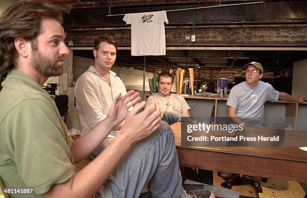 Staff Photo by Doug Jones, Wednesday, September 24, 2003: Space Gallery's brain trust from left, Nat May, minister of finance, Jeff Badger, Gallery...