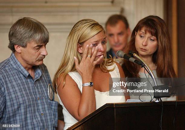 Staff Photo by Shawn Patrick Ouellette, Monday, June 30, 2003: Amy St. Laurent's sister Julie wipes away tears while speaking at the sentencing for...