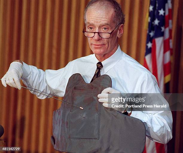 Thursday, September 23, 1999 -- Portland police chief Michael Chitwood points out where a knife penetrated a bullet-proof vest worn by Officer James...