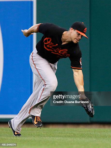 Right fielder Chris Davis of the Baltimore Orioles snags a fly ball hit by Ian Kinsler of the Detroit Tigers for an out during the fourth inning at...