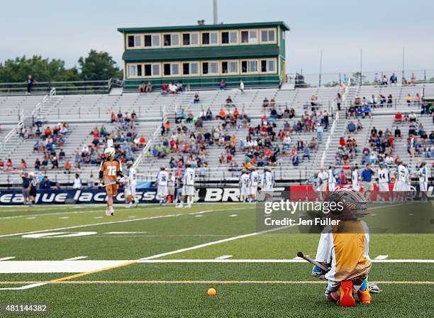 Young ball boy watches as the Rochester Rattlers prepare to play the Charlotte Hounds at Eunice Kennedy Shriver Stadium on July 17, 2015 in...