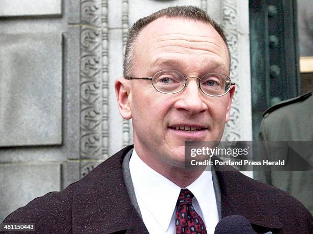 Staff Photo by Gordon Chibroski, Tuesday, December 18, 2001: Matt Stewart tells the press little about the investigation but seems happy that Jeffrey...