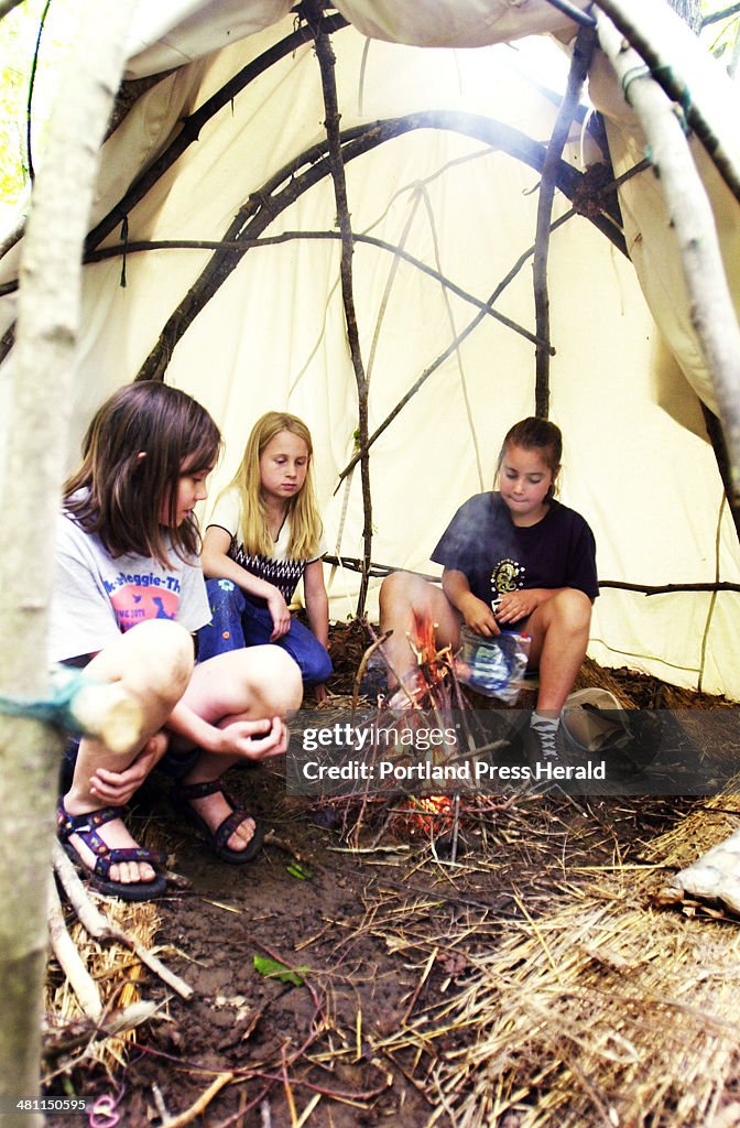 Megan Williams, 10, Dover, NH, Grace Bailey, 9, Strafford, NH, and Laurel Goslin, 10, York, make a f...