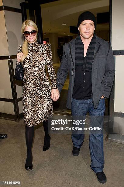 Paris Hilton and Cy Waits are seen at Los Angeles International Airport on February 19, 2011 in Los Angeles, California.