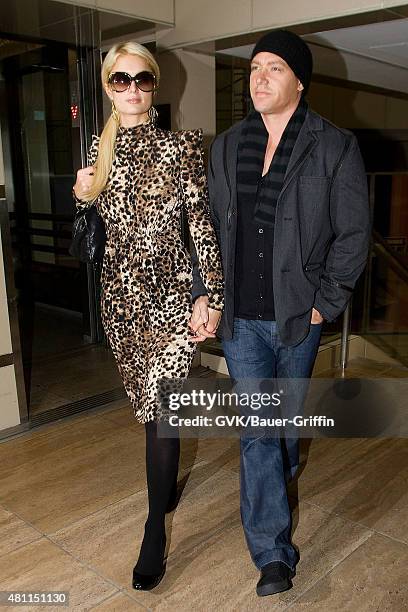 Paris Hilton and Cy Waits are seen at Los Angeles International Airport on February 19, 2011 in Los Angeles, California.