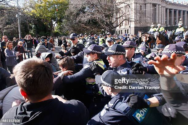 Protesters against racism clash with 'Reclaim Australia' protesters and Police on July 18, 2015 in Melbourne, Australia. 'Reclaim Australia'...