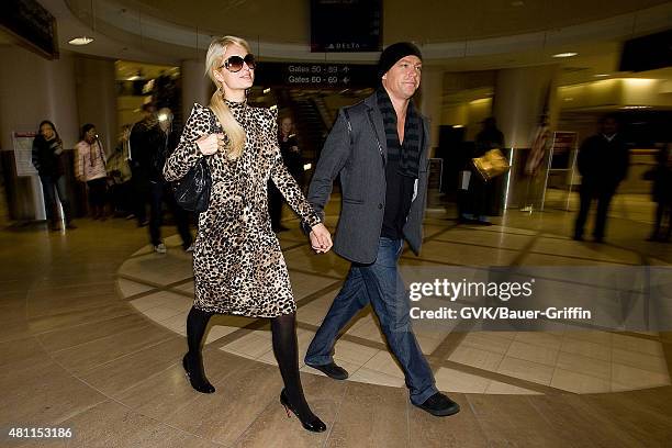 Paris Hilton and Cy Waits are seen at Los Angeles International Airport on February 19, 2011 in Los Angeles, California.