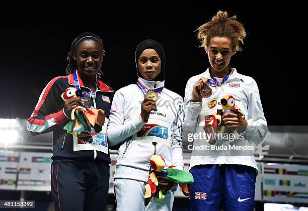 Salwa Eid Naser of Bahrain, gold medal, Lynna Irby of the USA, silver medal, and Catherine Reid of Great Britain, bronze medal, celebrate on the...