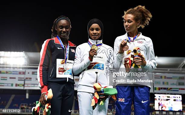 Salwa Eid Naser of Bahrain, gold medal, Lynna Irby of the USA, silver medal, and Catherine Reid of Great Britain, bronze medal, celebrate on the...