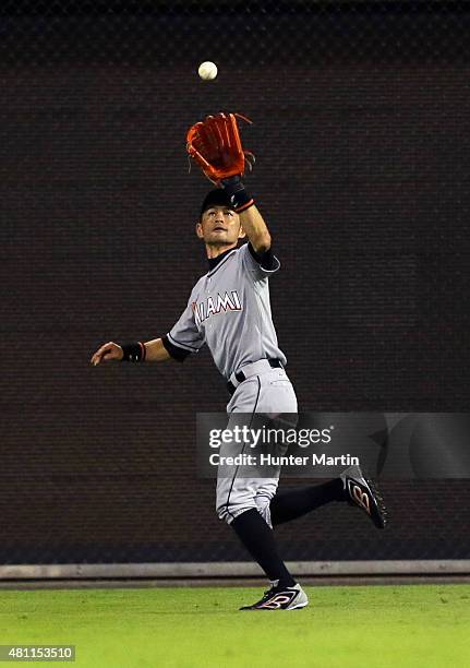 Ichiro Suzuki of the Miami Marlins catches a fly out in the seventh inning during a game against the Philadelphia Phillies at Citizens Bank Park on...