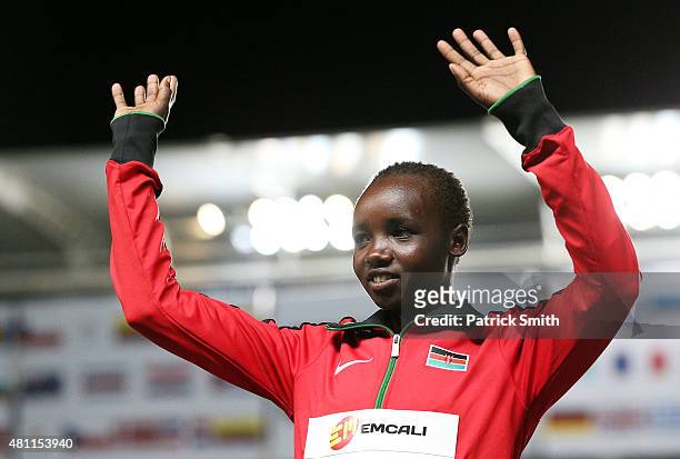 Celliphine Chepteek Chespol of Kenya, gold medal, celebrates on the podium after the Girls 2000 Meters Steeplechase final on day three of the IAAF...