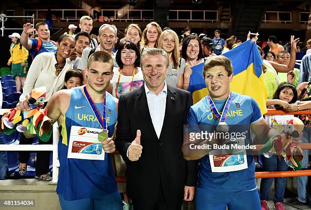 Hlib Piskunov of the Ukraine, gold medal, Mykhailo Havryliuk of the Ukraine, silver medal, and Ned Weatherly of Australia, silver medal, celebrate...