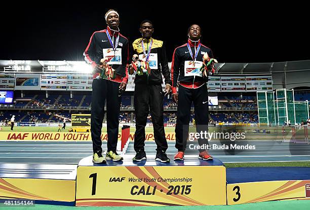 Christopher Taylor of Jamaica, gold medal, Josephus Lyles of the USA, silver medal, and Keshun Reed of the USA, bronze medal celebrate on the podium...