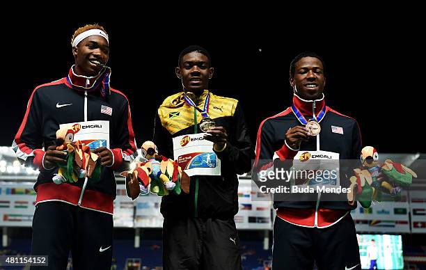 Christopher Taylor of Jamaica, gold medal, Josephus Lyles of the USA, silver medal, and Keshun Reed of the USA, bronze medal celebrate on the podium...