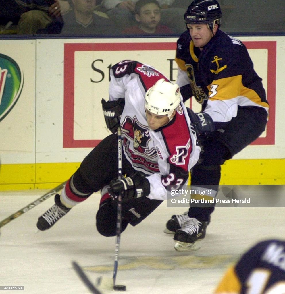 Joseph Boumedienne goes after the puck in front ot Norfolk Admiral Marty Wilford in first period act...