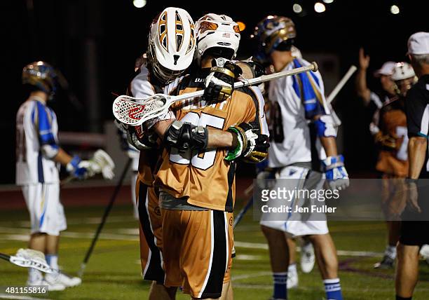 Kyle Denhoff and John Ranagan of the Rochester Rattlers celebrate a goal against the Charlotte Hounds at Eunice Kennedy Shriver Stadium on July 17,...