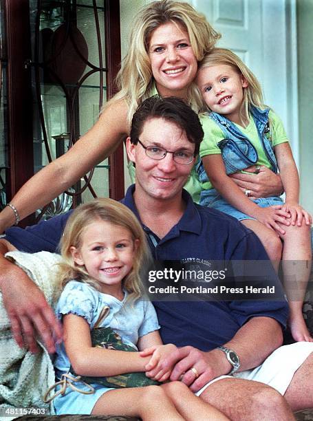 Staff Photo by Doug Jones, Fri, Aug 11, 2000: The Kaminski family Meghan, Kevin and their two daughters, McKenna , and Alexia in the living room of...