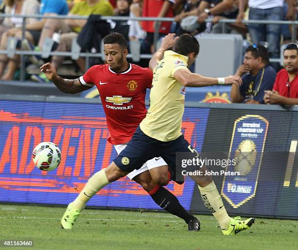Memphis Depay of Manchester United in action with Javier Guemez of Club America during the International Champions Cup 2015 match between Manchester...