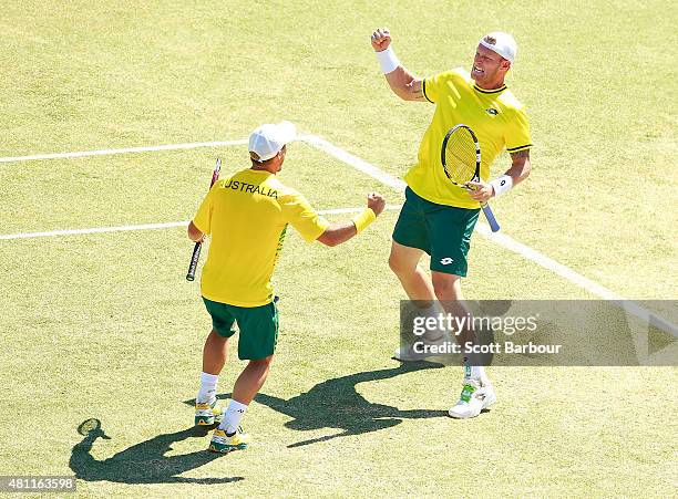 Sam Groth and Lleyton Hewitt of Australia celebrate match point as they defeat Andrey Golubev and Aleksandr Nedovyesov of Kazakhstan in the doubles...