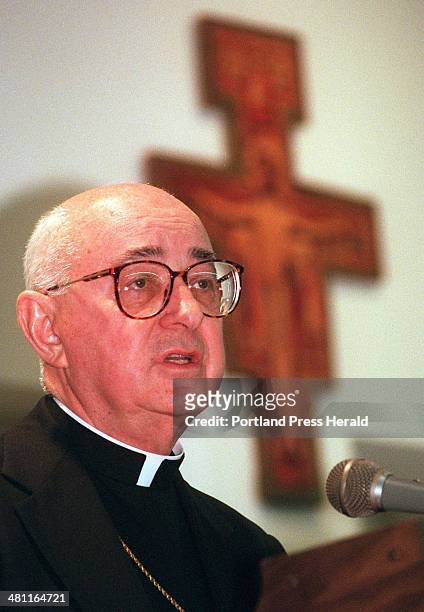 Sunday, December 1, 1996 -- Bishop Joseph J. Gerry announces a proposed plan calling for the closure of St. Dominic's Roman Catholic church during a...