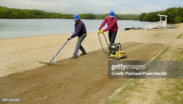 Staff Photo by Gordon Chibroski, Wednesday, May 23, 2001: Workers from S & A Drake, Inc., a company that specializes in concrete bridges and dams,...