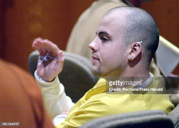 Staff Photo by Gordon Chibroski, Tuesday, February 12, 2002: Jeffrey Gorman waves to an acquaintance after being brought into Superior Court in...