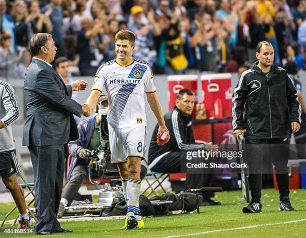 Steven Gerrard of Los Angeles Galaxy is congratulated by Coach Bruce Arena during Los Angeles Galaxy's MLS match against San Jose Earthquakes at the...